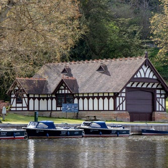 view of boats moored on the River Thames in front of the Boat House at Cliveden